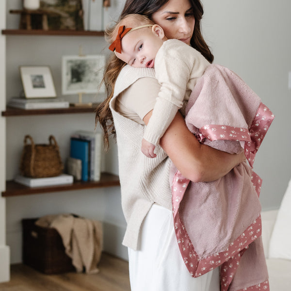 Mother and daughter enjoying the warm and breathable receiving blanket.