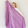 A little girl holds a Luxury Toddler Fairy Wings (light pink purple) Colored Lush Saranoni Blanket. The soft blanket is a toddler blanket or baby blanket.