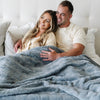 Big and cozy Saranoni blanket on a bed, providing ultimate comfort.