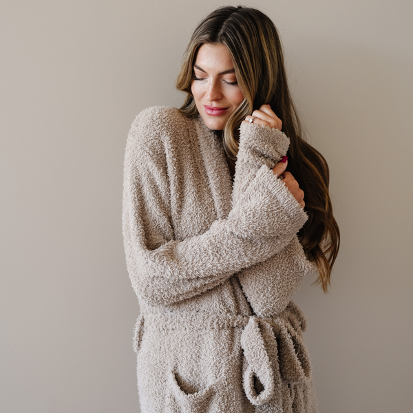 Woman wearing taupe cozy bamboni robe. 