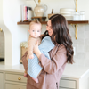 A mother holds her baby boy and a buttery-soft Saranoni blanket, featuring a breathable, plush waffle texture in a soothing blue hue. This luxury mini blanket is the best baby blanket as a newborn blanket and infant blanket—perfect as a cozy blanket for snuggles or a must-have infant blanket. Designed for softness and comfort, this plush baby blanket makes an ideal baby boy gift or gift for new moms. Enjoy this luxury blanket!