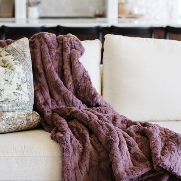 A dusty mauve luxurious patterned faux fur extra large throw blanket that is a Saranoni blanket. This ultra-soft, cozy blanket adds a touch of elegance and warmth to any space, perfect as a soft oversized blanket or fluffy blanket for lounging. Ideal for those seeking a high-quality artificial fur blanket or luxury blanket, this versatile and stylish soft blanket enhances both comfort and decor. Shop the best blankets and throws for ultimate relaxation and cozy vibes.