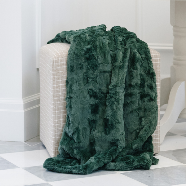 A green luxurious patterned faux fur throw blanket that is a Saranoni blanket. This ultra-soft, plush throw blanket adds a touch of elegance and warmth to any space, perfect as a soft throw blanket or fluffy blanket for lounging. Ideal for those seeking a high-quality artificial fur blanket or luxury blanket, this versatile and stylish soft blanket enhances both comfort and decor. Shop the best blankets and throws for ultimate relaxation and cozy vibes.