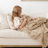 A mother and her baby girl have a khaki luxurious patterned faux fur throw blanket that is a Saranoni blanket. This ultra-soft, plush throw blanket adds a touch of elegance and warmth to any space, perfect as a soft throw blanket or fluffy blanket for lounging. Ideal for those seeking a high-quality artificial fur blanket or luxury blanket, this versatile and stylish soft blanket enhances both comfort and decor. Shop the best blankets and throws for ultimate relaxation and cozy vibes.