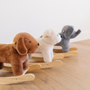 A collection of three adorable plush rockers in a brown dog, cream bear, and gray elephant, each resting on a sturdy wooden base. These soft and cuddly rocking toys are perfect for children's playrooms, providing a cozy and playful atmosphere. Ideal for parents searching for stylish and comfortable toys that encourage imaginative play.