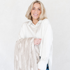 A woman smiles while holding a Saranoni blanket, specifically the tan marbled faux fur/minky extra large blanket, highlighting its ultra-soft texture and luxurious design. This plush blanket features a dual-texture blend of silky minky and cozy faux fur, creating the ultimate cozy blanket for home decor. Perfect luxury blanket for lounging or adding style to any space. Soft blanket, cozy blanket—experience unmatched warmth with a Saranoni blanket. 