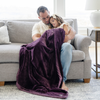 A father and daughter sit with a Toddler Aubergine (deep purple) Colored Lush Luxury Saranoni Blanket. The soft blanket is a baby blanket or toddler blanket.