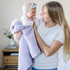 A mother holds her little girl in a buttery-soft Saranoni blanket, featuring a breathable, plush waffle texture in a soothing light purple hue. This luxury toddler blanket is the best kids blanket as a baby blanket or toddler blanket—perfect as a cozy blanket for snuggles or a must-have infant blanket. Designed for softness and comfort, this plush toddler blanket makes an ideal toddler gift. Enjoy this luxury blanket!