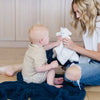 Mom and son playing with stuffed animal lovey, sitting on Nautical Blue BAMBONI® RECEIVING BLANKETS - Saranoni