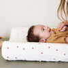 A mother plays with her baby boy who is laying on an ultra-soft Saranoni Minky Stretch Luxe changing cover in a star pattern, crafted from 94% polyester and 6% spandex for extra stretch and durability. Perfect for any baby nursery, this breathable, stretchy changing pad cover ensures a snug fit while adding a touch of style. Ideal for parents seeking high-quality baby essentials that are soft, luxurious, and easy to care for – wash cold, no softeners, hang or lay flat to dry.