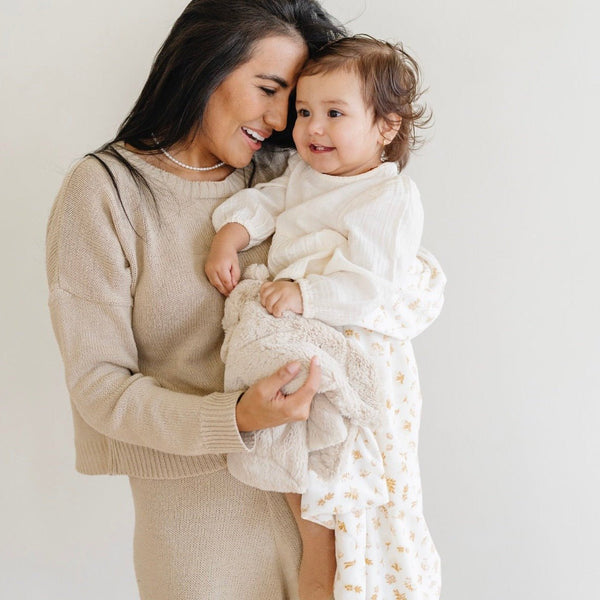 Mom and daughter smiling with floral MINKY STRETCH RECEIVING BLANKETS - Saranoni