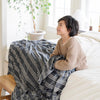 Boy smiling with MINKY STRETCH THROW BLANKETS - Saranoni