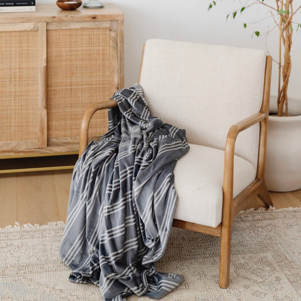 Beautiful blanket hung over white chair - MINKY STRETCH THROW BLANKETS - Saranoni