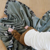 Luxuriously soft Saranoni toddler blanket in green camo, ideal for keeping your toddler warm and secure.