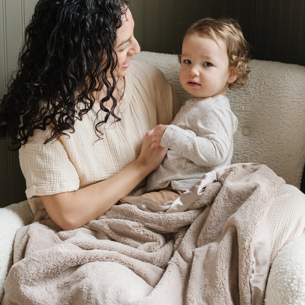 Snuggly receiving blanket with a soft, gentle texture, perfect for wrapping your baby in warmth.