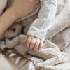 Snuggly receiving blanket with a soft, gentle texture, perfect for wrapping your baby in warmth.