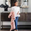 A little girl holds a Toddler Blossom (light peachy pink) Colored Lush Luxury Saranoni Blanket. The soft blanket is a baby blanket or toddler blanket.