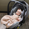 Newborn baby girl in carseat wrapped in comfy BAMBONI® MINI BLANKETS - Saranoni