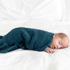 Baby boy falling asleep wrapped in super cozy BAMBONI MINI BLANKETS - Saranoni