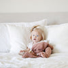 Adorable little girl playing with soft and stretchy BAMBONI MINI BLANKETS - Saranoni