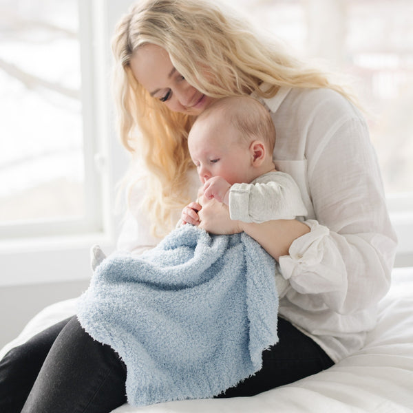 Mom and baby boy playing with light blue BAMBONI MINI BLANKETS - Saranoni