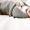 Details of adorably baby boy wrapped in gray BAMBONI MINI BLANKETS - Saranoni