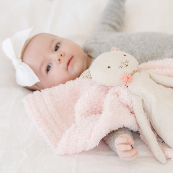 Adorable baby nursery room with kitty stuffed animal and matching light pink BAMBONI MINI BLANKETS - Saranoni