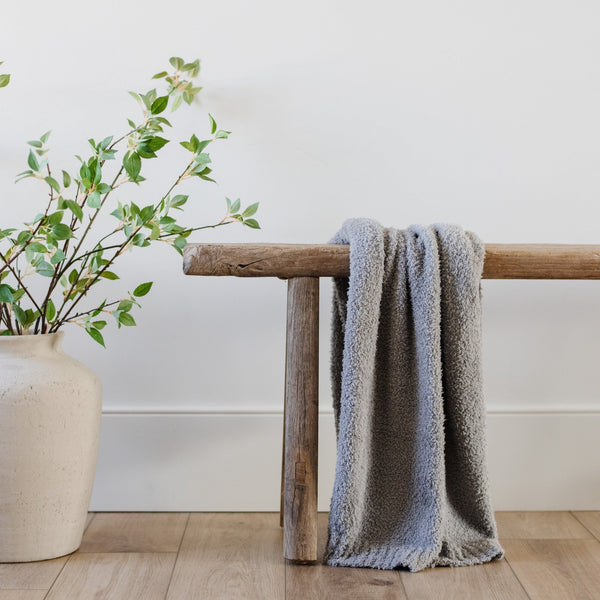 Super soft, comfortable gray blanket sitting on wooden bench, house decor - BAMBONI® RECEIVING BLANKETS - Saranoni