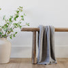 Super soft, comfortable gray blanket sitting on wooden bench, house decor - BAMBONI® RECEIVING BLANKETS - Saranoni