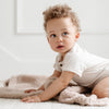 Adorable baby boy crawling with Birch BAMBONI RECEIVING BLANKETS - Saranoni