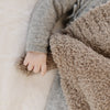 Details of baby holding on to super comfy and cozy Taupe color BAMBONI RECEIVING BLANKETS - Saranoni