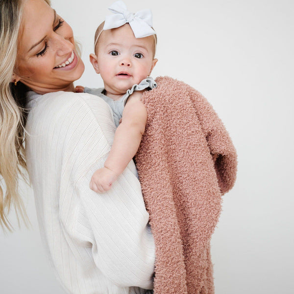 Baby girl snuggling with mom in French Rose BAMBONI RECEIVING BLANKETS - Saranoni