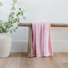 Super soft and stretchy light pink blanket on wooden bench - BAMBONI® RECEIVING BLANKETS - Saranoni