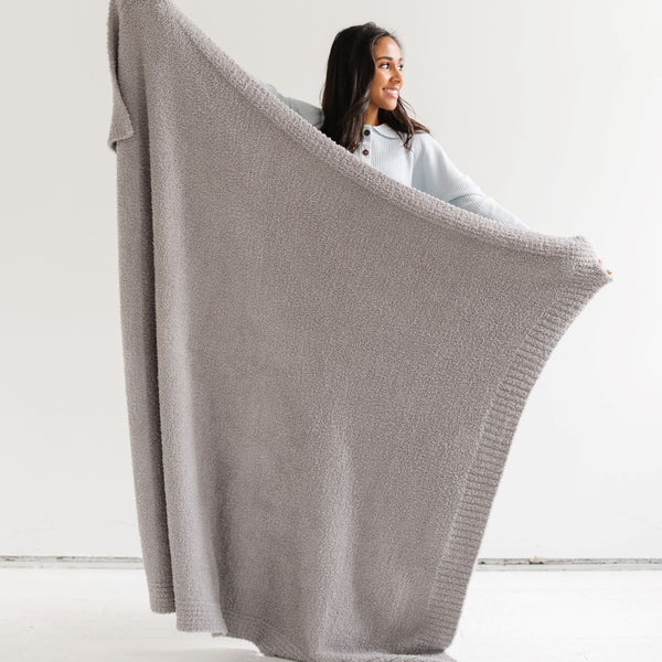 Girl stretching out beautiful, stretchy Gray BAMBONI THROW BLANKETS - Saranoni