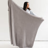 Girl stretching out beautiful, stretchy Gray BAMBONI THROW BLANKETS - Saranoni