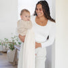 Mom holding adorable baby boy, wrapped in Ivory BAMBONI® THROW BLANKETS - Saranoni