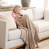 Girl wrapped in super cozy and soft Taupe BAMBONI TODDLER BLANKETS - Saranoni