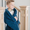 Young boy wrapped in Nautical Blue BAMBONI TODDLER BLANKETS - Saranoni