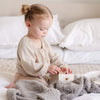 Adorable baby girl playing iwth toys on her soft, gray BAMBONI TODDLER BLANKETS - Saranoni