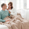 Husband and wife snuggling in extra soft and comfy Birch BAMBONI XL BLANKETS - Saranoni