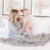 Mom playing with young daughter on extra comfy Gray BAMBONI XL BLANKETS - Saranoni