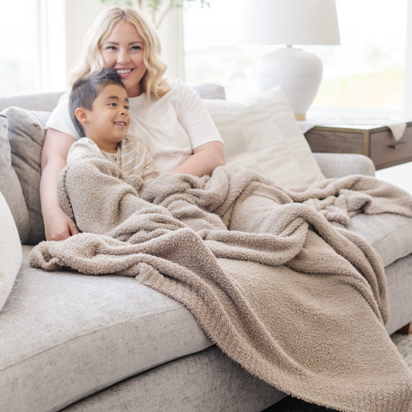 Mom and son snuggling up in super soft Taupe BAMBONI XL BLANKETS - Saranoni