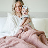 Mom and newborn snuggling in beautiful French Rose BAMBONI XL BLANKETS - Saranoni