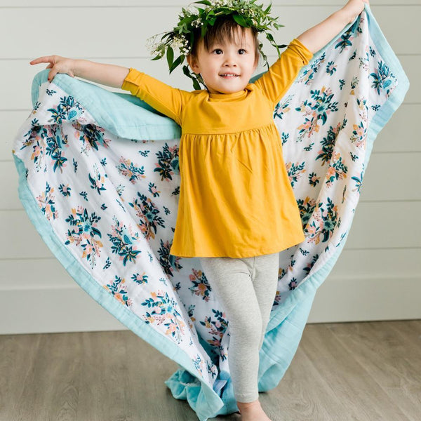 Cozy and soft bamboo rayon muslin quilt with a delightful pattern, perfect for wrapping your child in comfort.