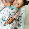 Beautiful blue floral print lightweight and breathable kids' bamboo rayon muslin quilt, adorned with a fun pattern for a cozy night’s sleep.