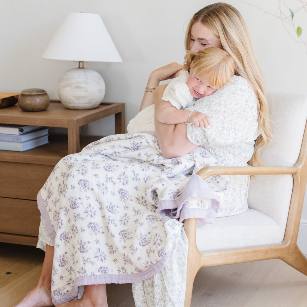 Luxuriously soft purple floral bamboo rayon muslin quilt with a beautiful pattern, perfect for adding style and comfort to your space.