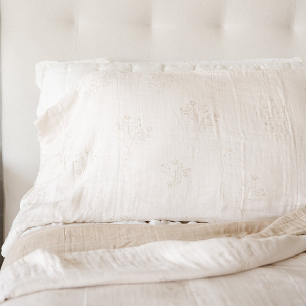 Detailed shot of a beautiful and elegant floral printed bamboo rayon muslin quilt. 