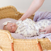 Newborn girl wrapped in an ultra-cozy and soft baby swaddle, offering a luxurious embrace for your newborn.