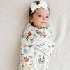 A beautiful floral soft and breathable bamboo muslin swaddle, perfect for wrapping your baby in gentle comfort.