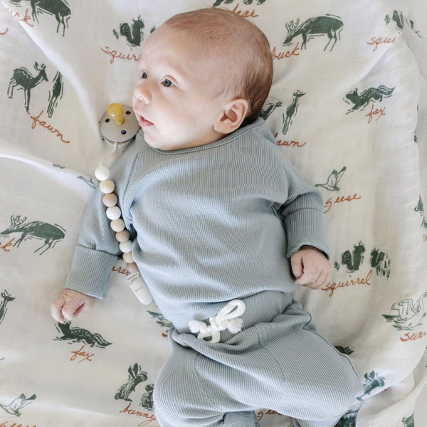 Luxurious and cozy baby swaddle, designed to cradle your baby in soft, plush comfort.